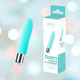 A VeDO Bam Mini Rechargeable Bullet Vibrator in turquoise, featuring a metallic base, is placed next to its coordinating packaging. The box prominently displays the name "Bam Mini" and emphasizes its powerful functionality with "10 vibration modes," set against a soft, blurred background.